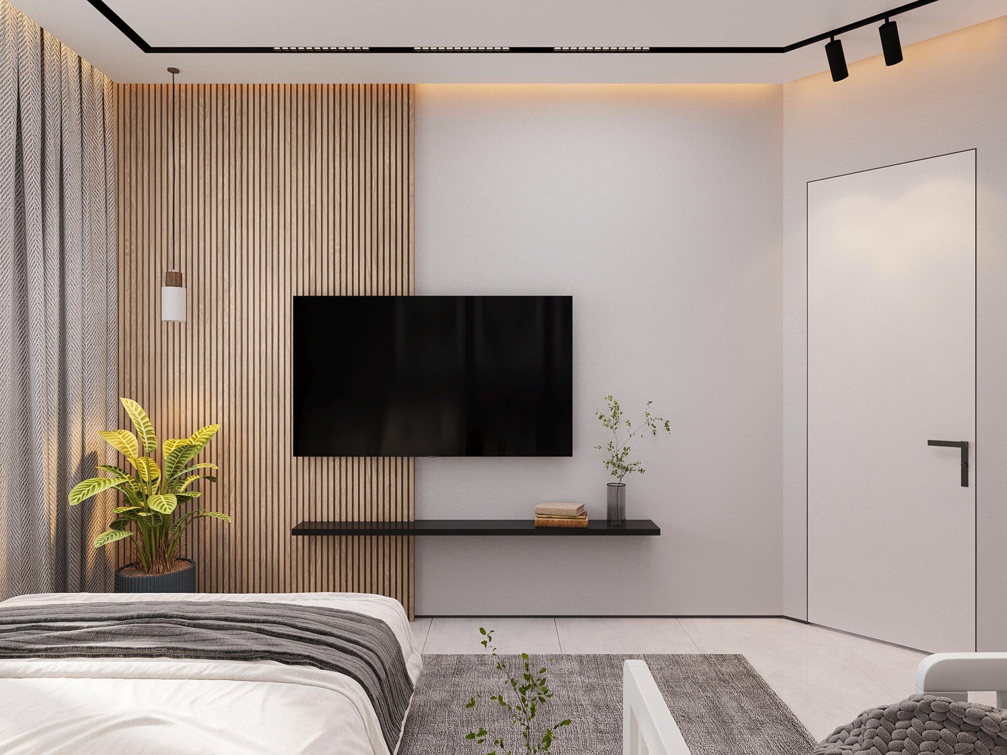 Bedroom TV wall with timber slats and a floating shelf
