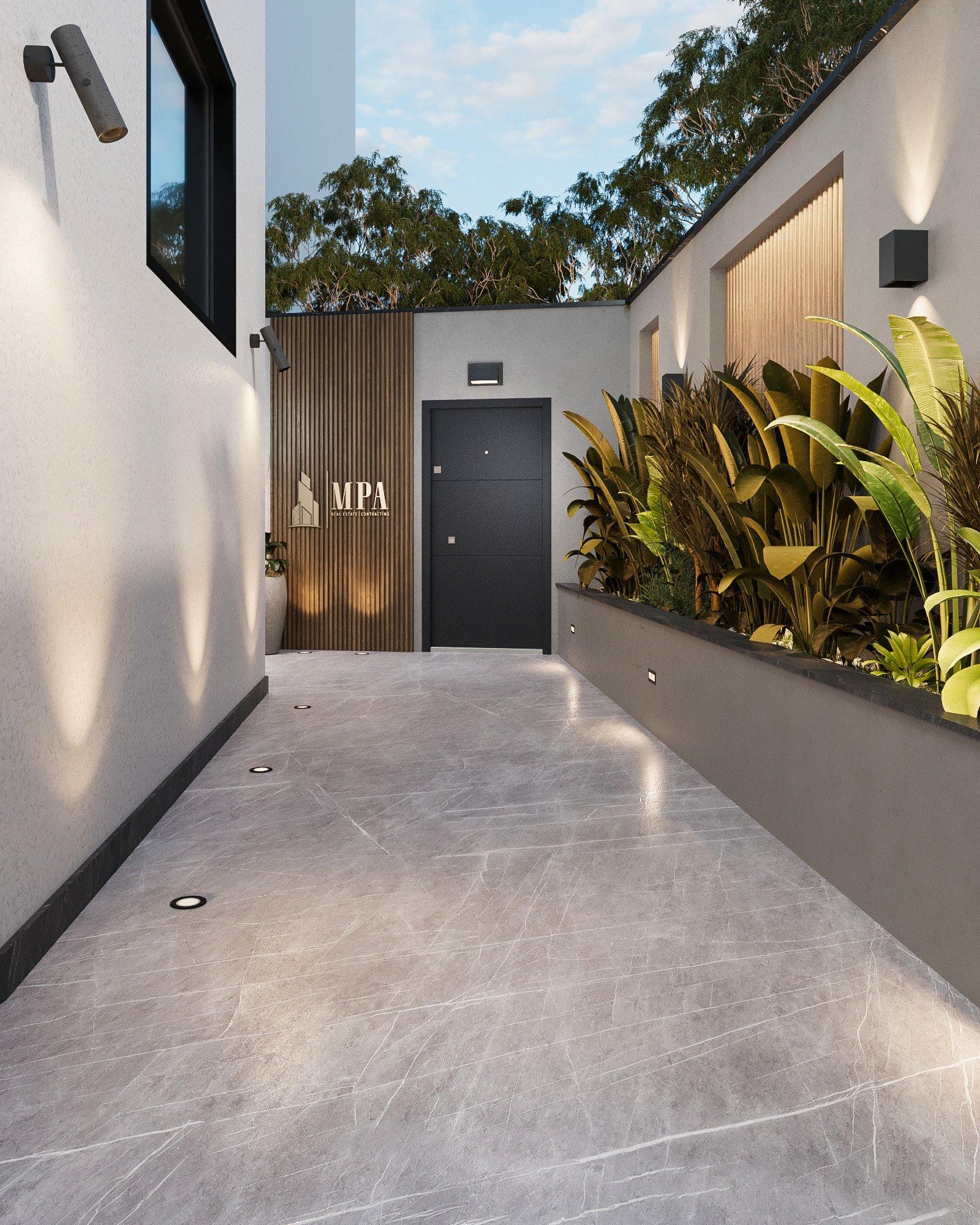 Entrance passage with planting and the MPA logo on a timber wall