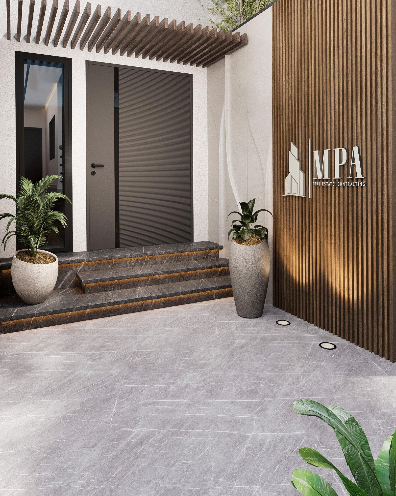 Lit MPA logo on a timber wall beside the entrance door
