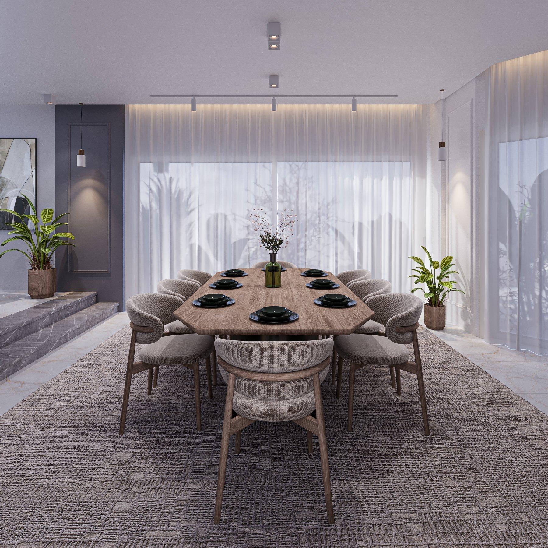 Dining area with a solid wood table, sand-toned chairs and sheer curtains