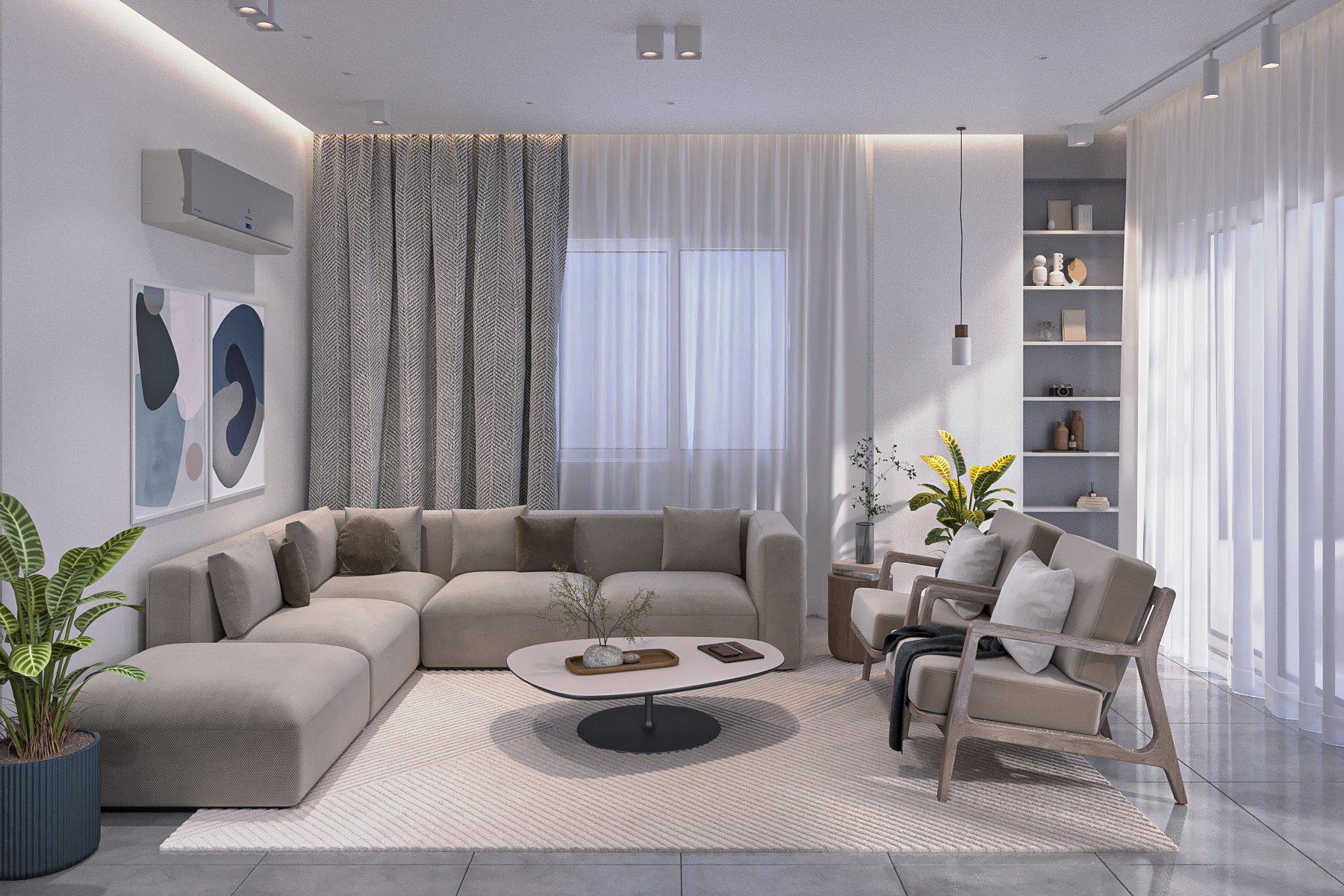 Living room with a grey L-shaped sofa, oval coffee table and full-height sheer curtains